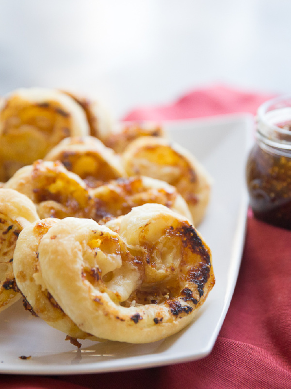 fig and gruyere palmiers on a white plate