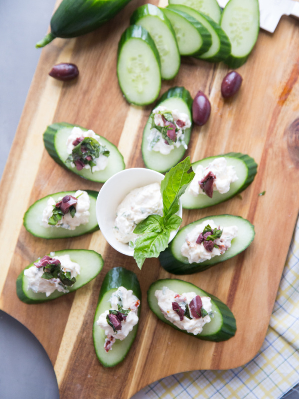 greek salad bites displayed on board