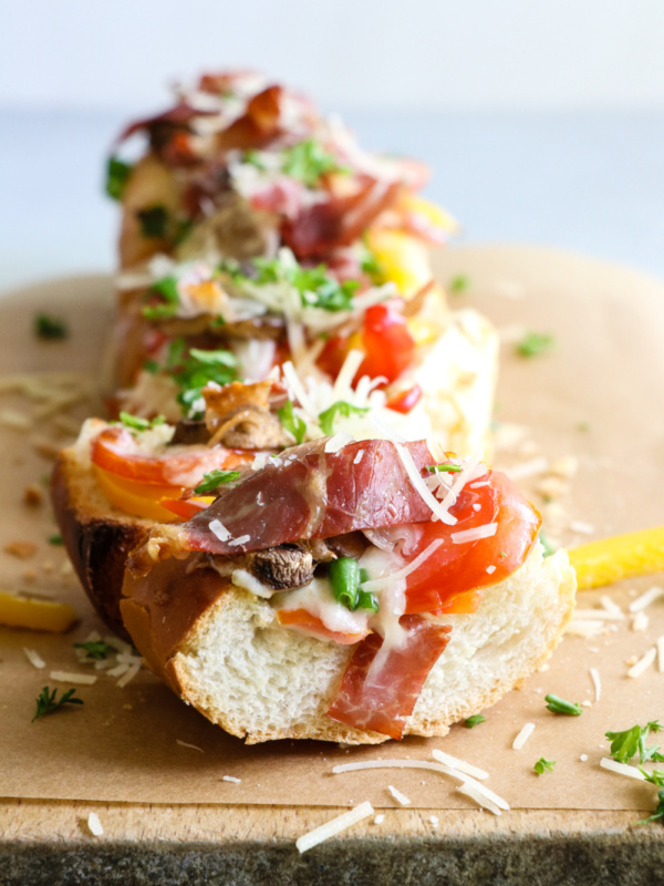 loaded bruschetta on a wood board