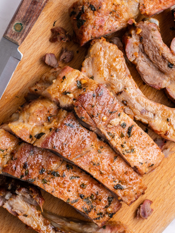 garlic and oregano pork ribs on a cutting board