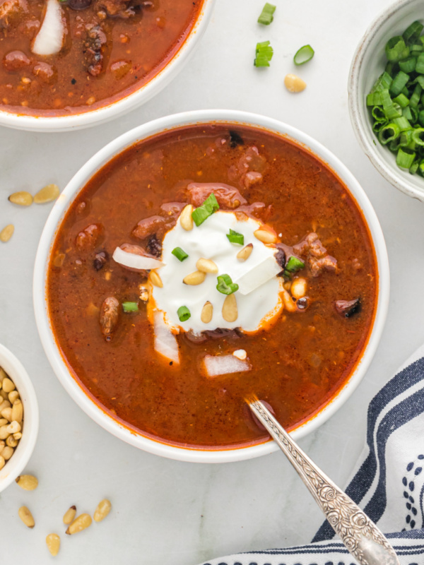 bowl of chili topped with sour cream