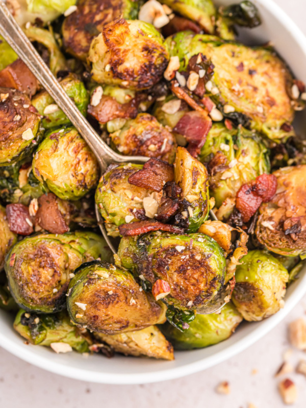 pan of brussels sprouts with bacon and hazelnuts