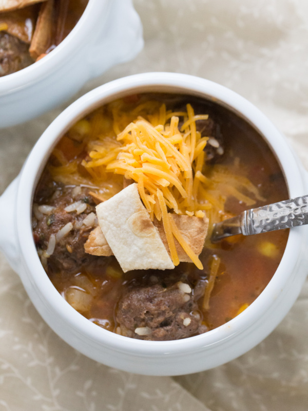 one white bowl of mexican meatball and sausage soup