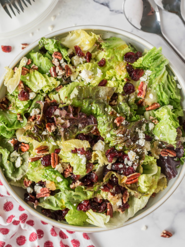 mixed green salad with apple cider vinaigrette in bowl