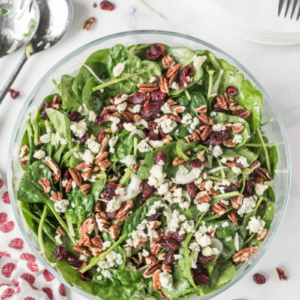 Spinach and Endive Salad with Blue Cheese and Pecans in a bowl