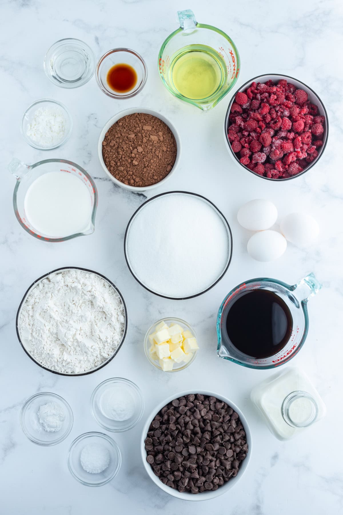 ingredients displayed for making double chocolate cake with raspberry filling