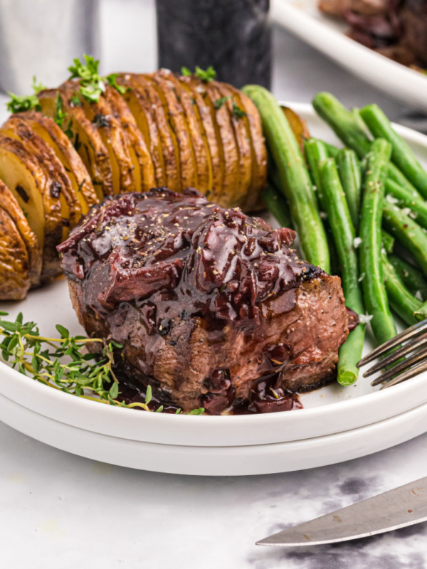 filet mignon with mushroom cabernet sauce on plate