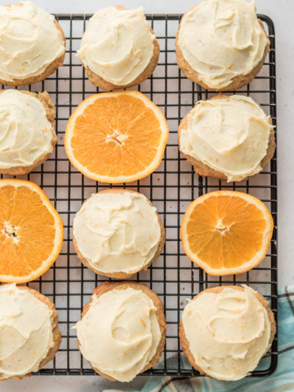 iced orange cookies on cooling rack