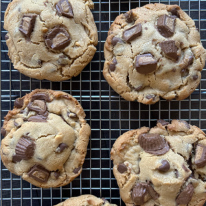 reeses stuffed chocolate chip cookies on a cooling rack