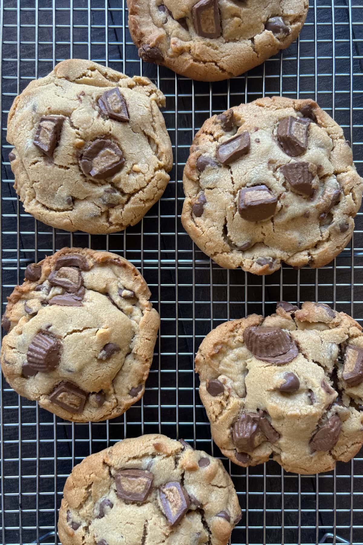 reeses stuffed chocolate chip cookies on a cooling rack
