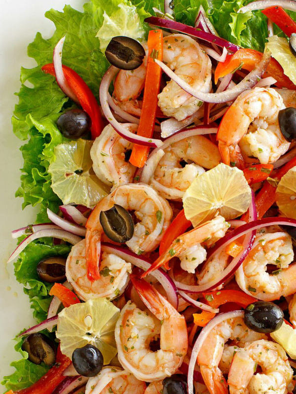 spicy lemon shrimp salad edged by lettuce leaves