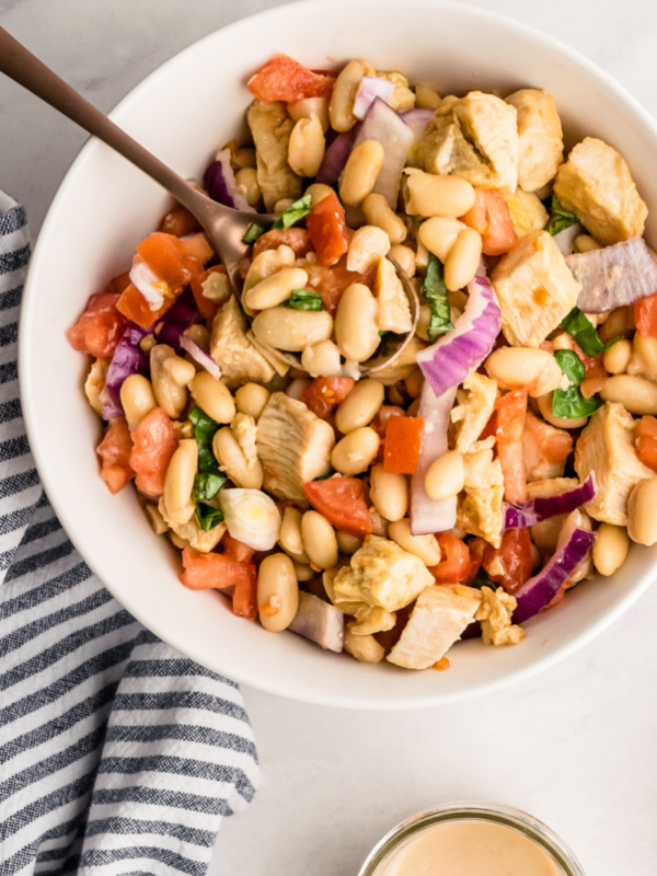 white bowl of white bean and roasted chicken salad