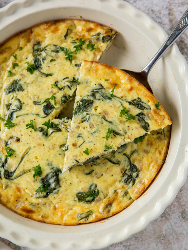 slicing crustless spinach and cheese quiche