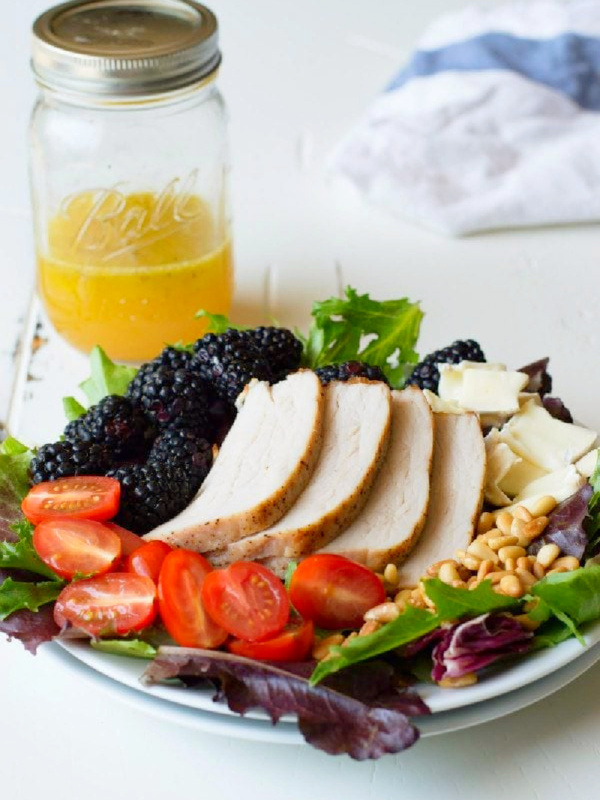 plate of blackberry salad with pork