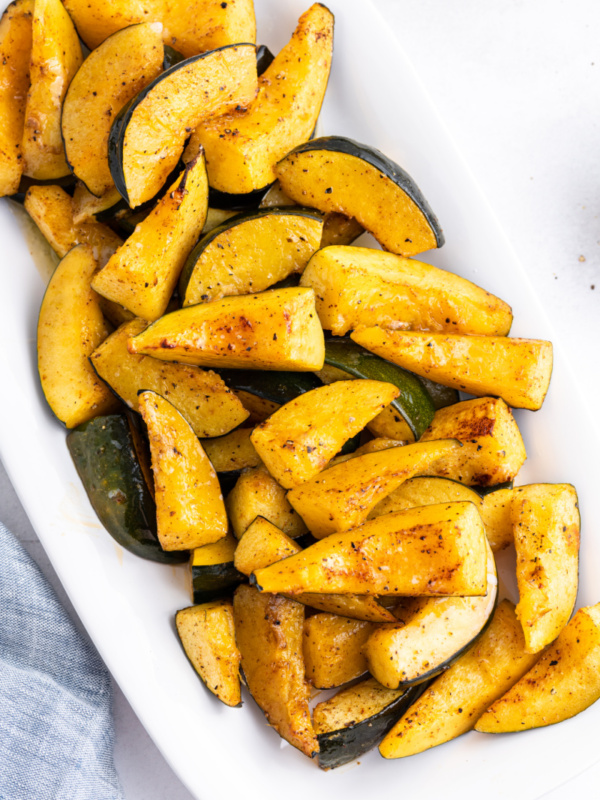 chili roasted acorn squash on white platter