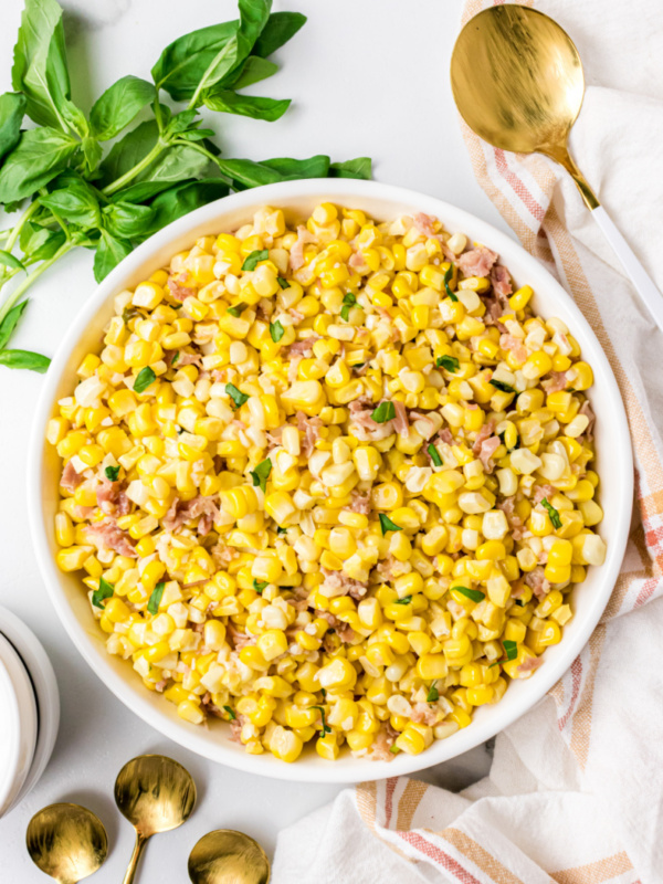 fresh corn with prosciutto basil butter in bowl