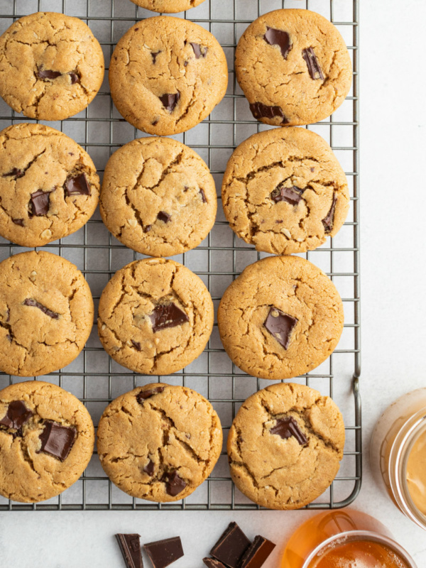 honey peanut butter chocolate chunk cookies on a cooling rack