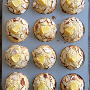 overhead shot of meyer lemon ricotta muffins in muffin tin