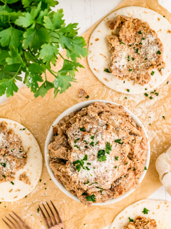 rubios pinto beans in a bowl and on tortillas