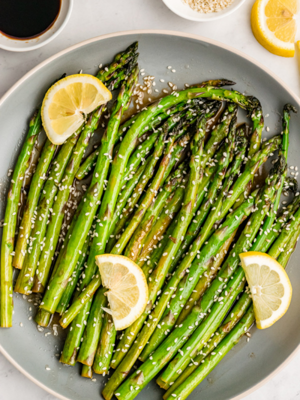 sesame asparagus with lemon on a plate