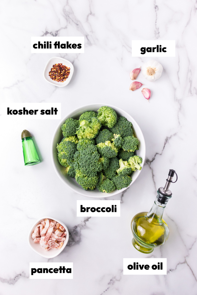 ingredients displayed for making slow cooked broccoli with garlic and pancetta