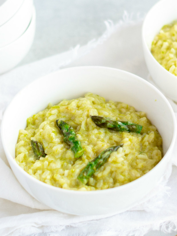 asparagus risotto in white bowl