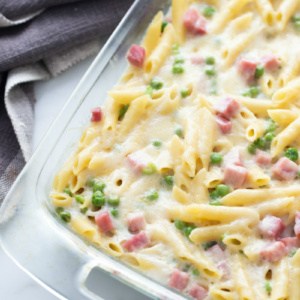 cheesy baked penne in glass dish just out of oven