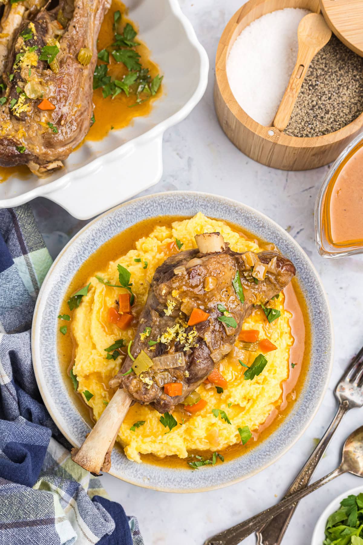 overhead shot of lamb osso buco on plate with mashed potato