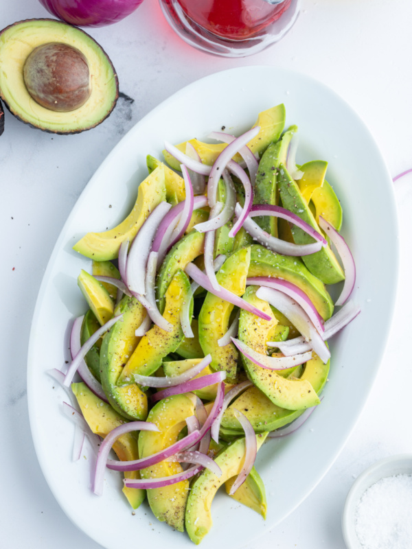 avocado and onion salad on oval platter