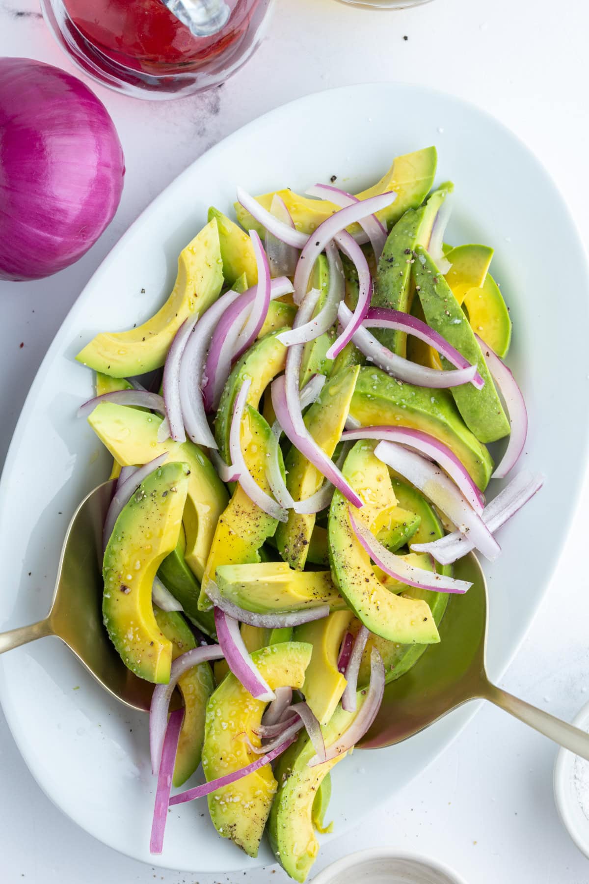 avocado and onion salad on oval platter