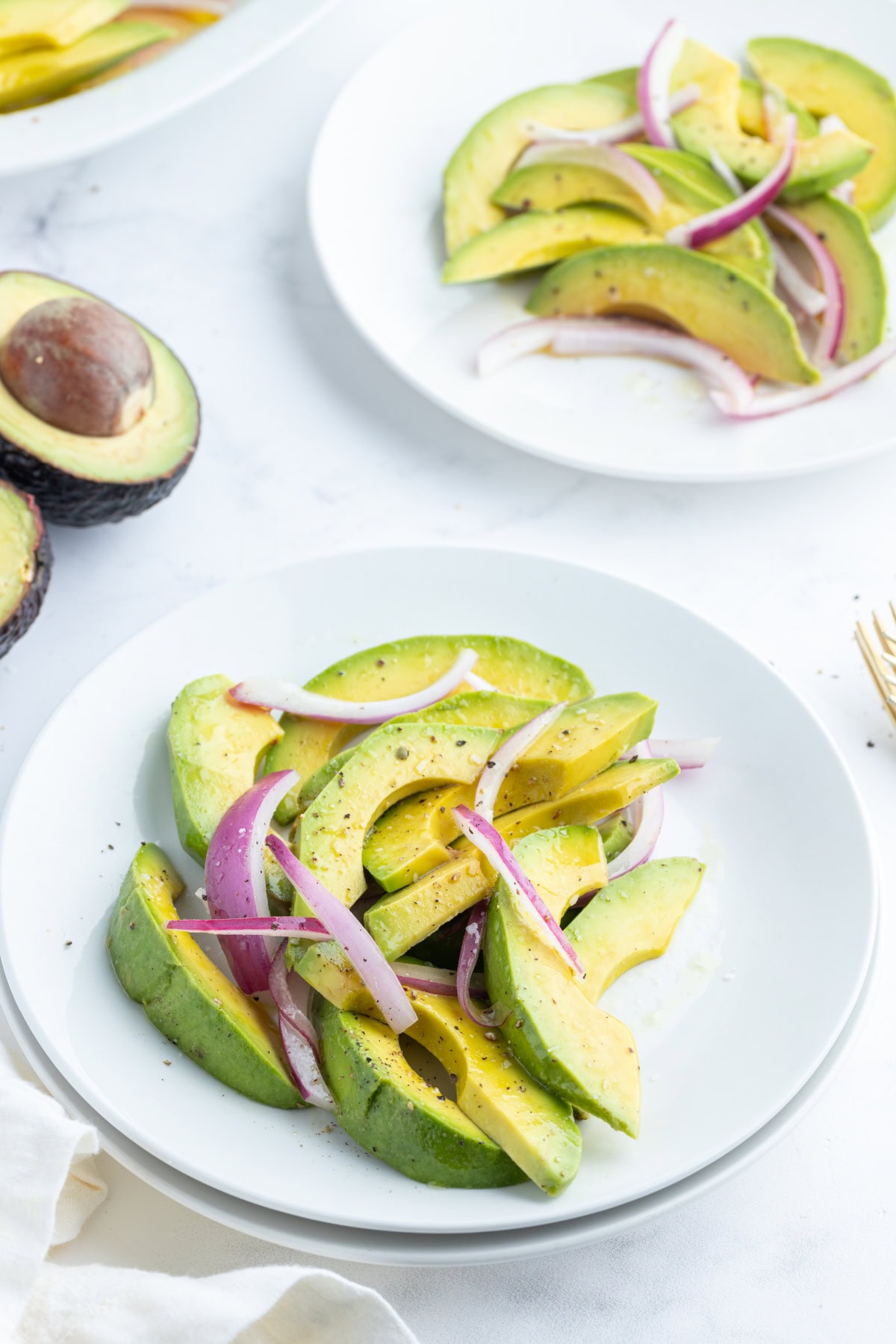 avocado and onion salad servings on plate
