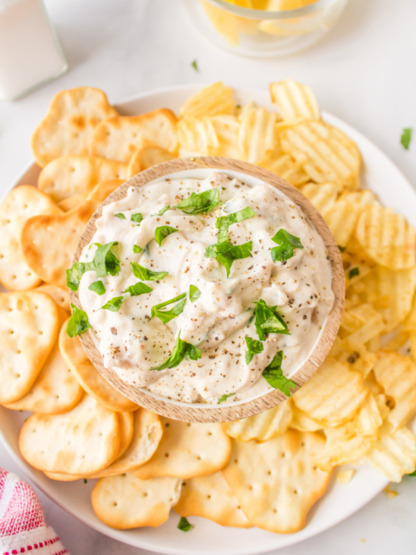 clam dip in bowl with potato chips