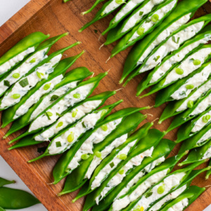 crab and cream cheese stuffed snow peas in a tray