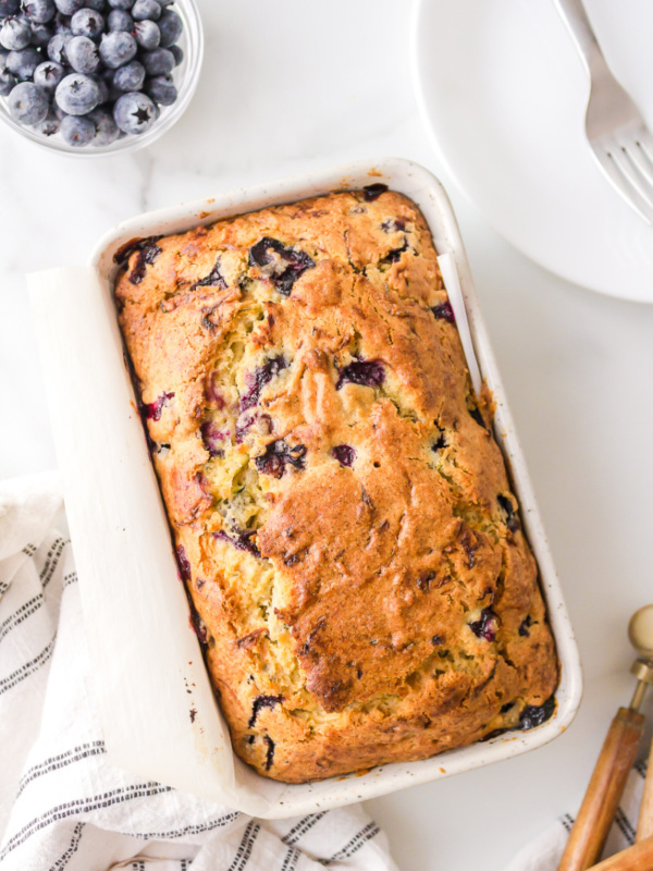 loaf of blueberry zucchini bread in pan