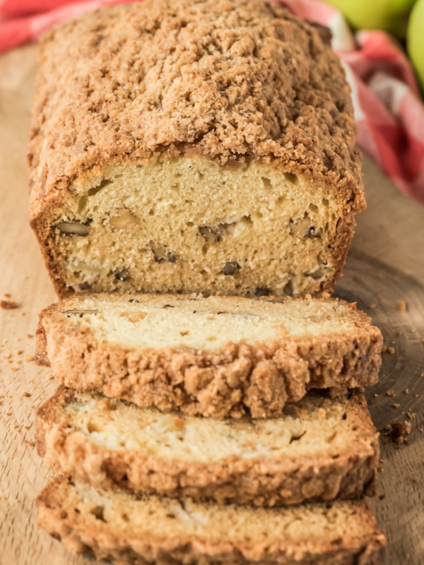 loaf of dutch apple bread on cutting board sliced