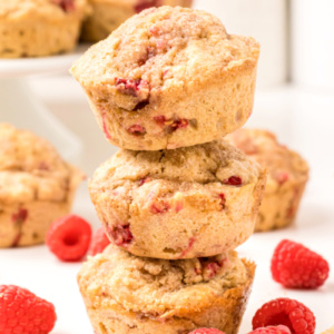 three raspberry muffins stacked