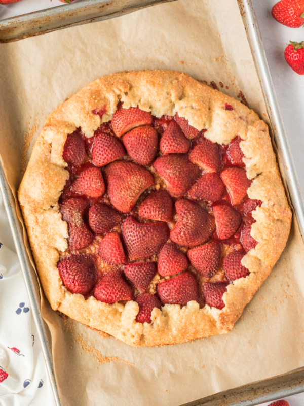 rustic strawberry galette on baking sheet