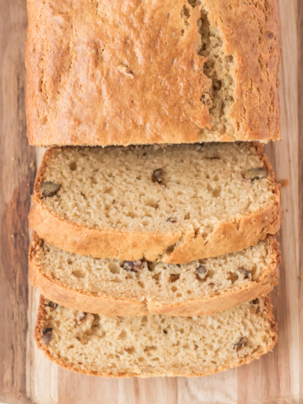 loaf of sour cream maple bread cut on cutting board