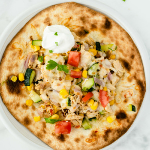 chicken and summer vegetable tostada overhead shot