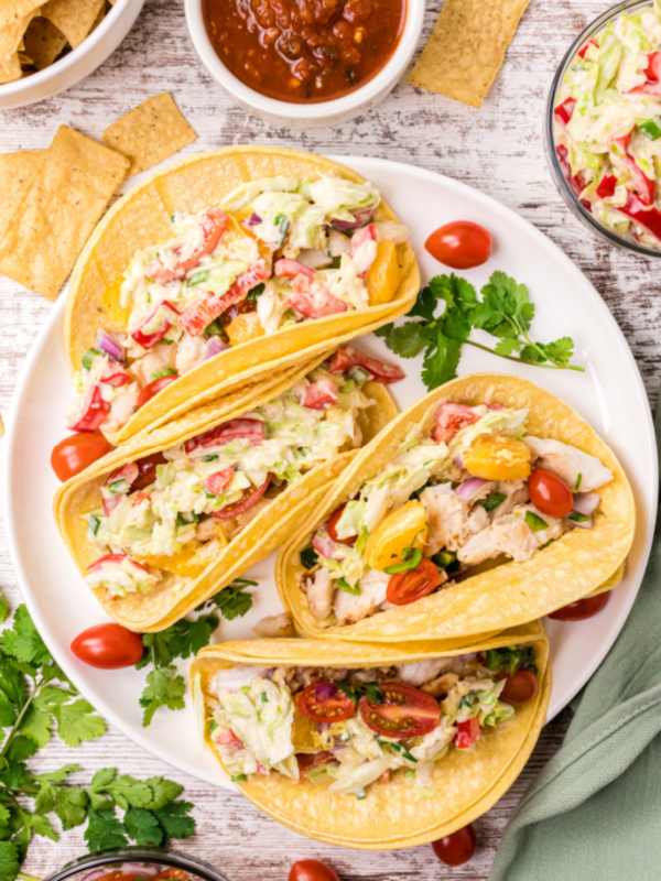 fish tacos with citrus salsa on a plate