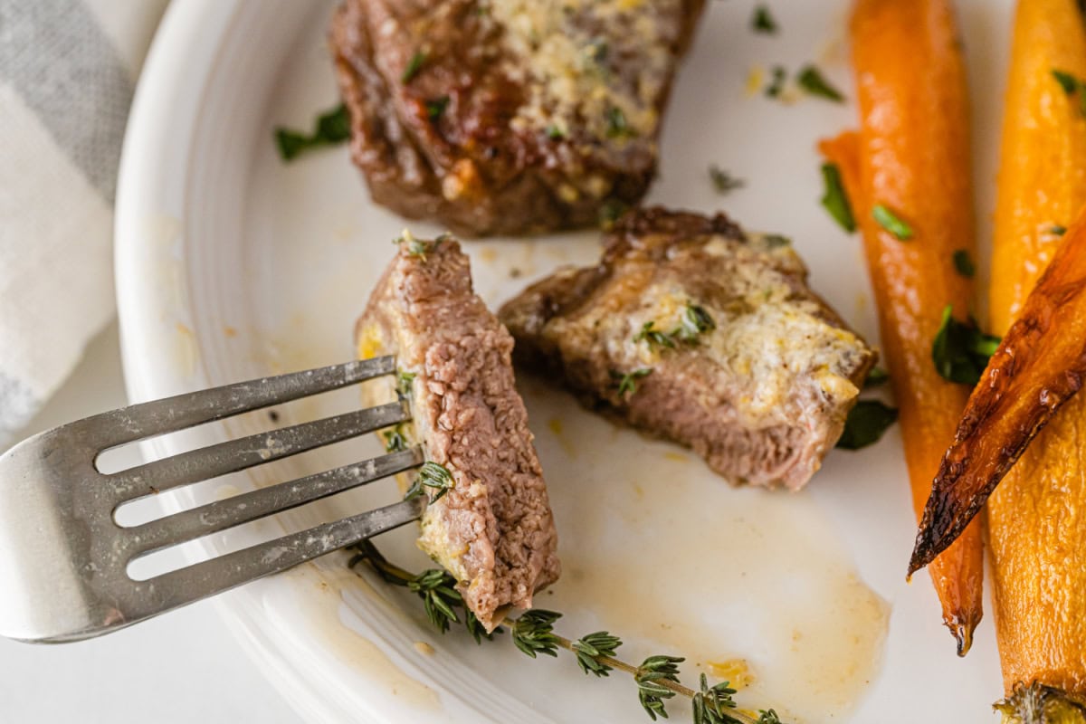 fork full of cooked lamb