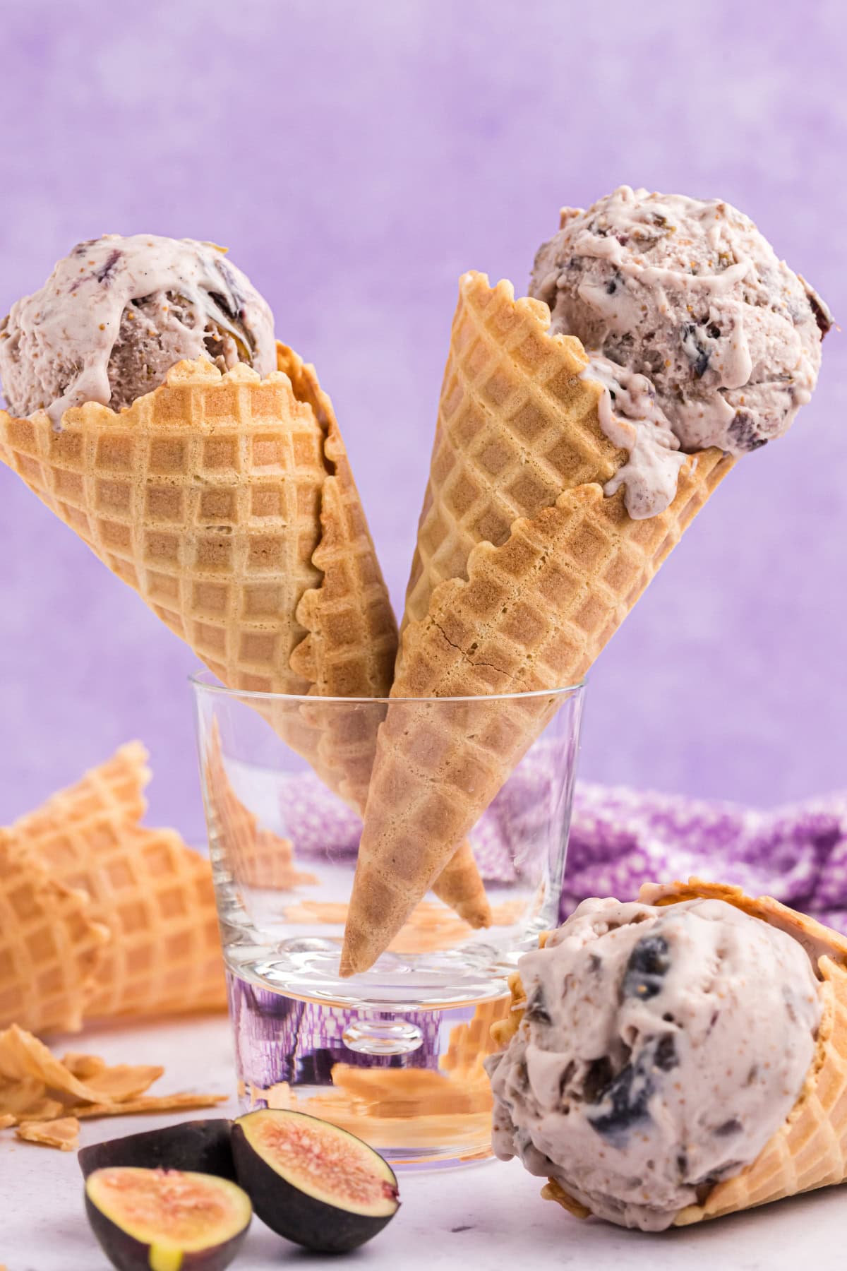 two ice cream cone sitting up in glass