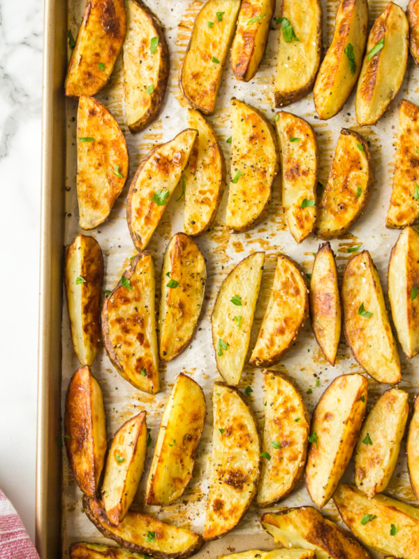 thick cut oven roasted fries on a baking sheet