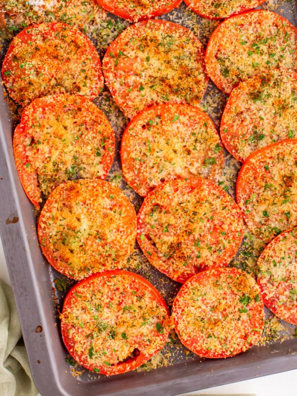 Tomatoes with Asiago on a baking sheet