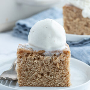 slice of ginger spice cake with ice cream on top