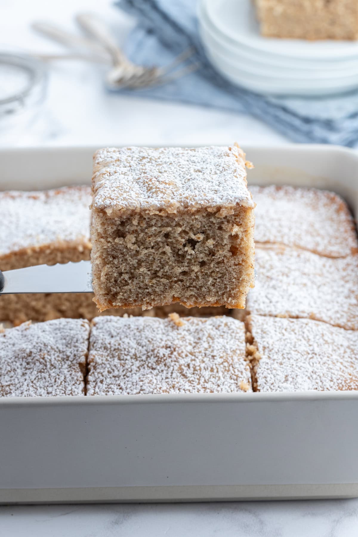 spatula holding up piece of ginger spice cake