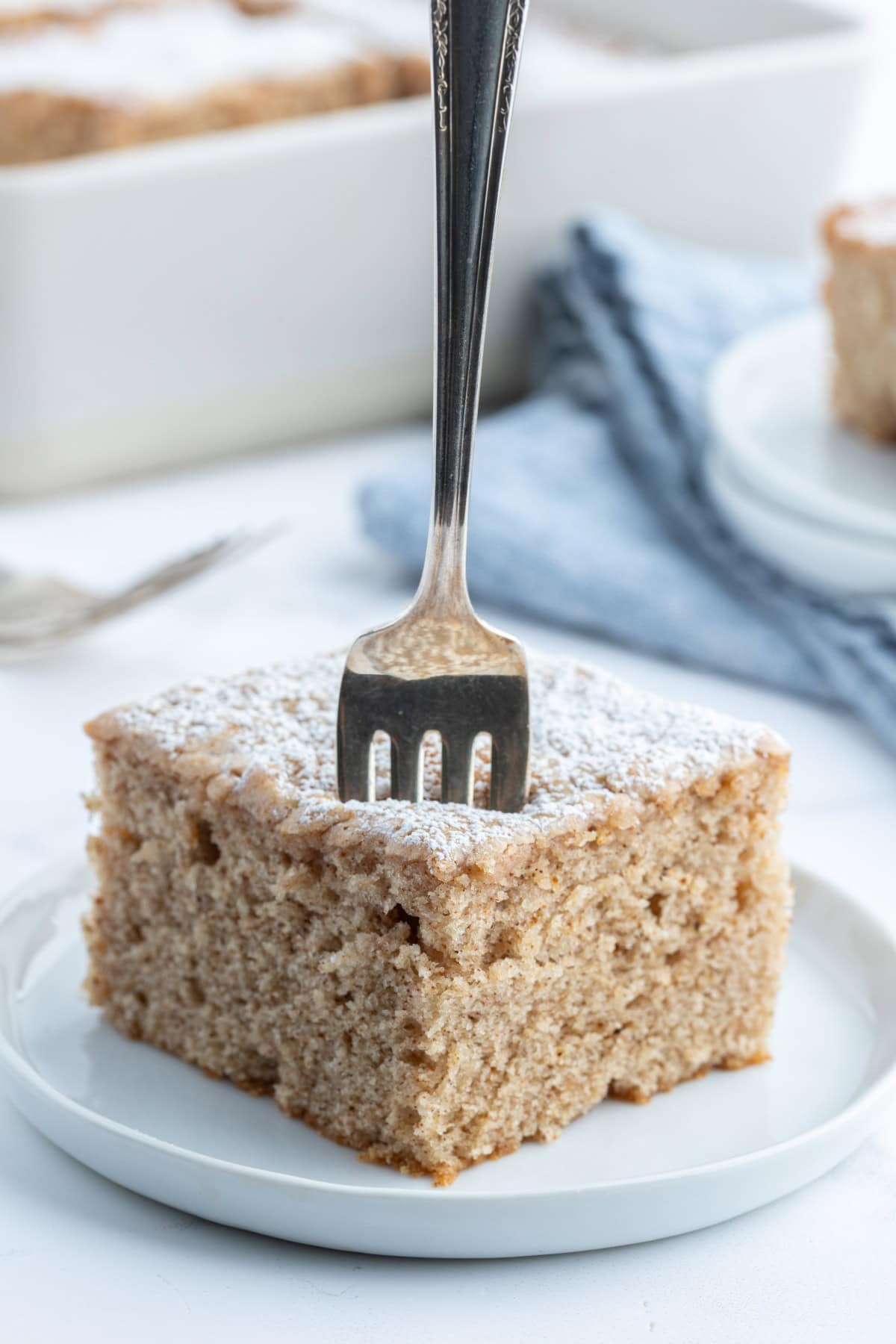 fork in slice of ginger spice cake