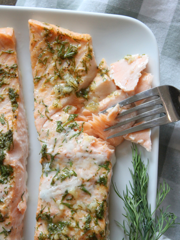 fork pulling cooked salmon