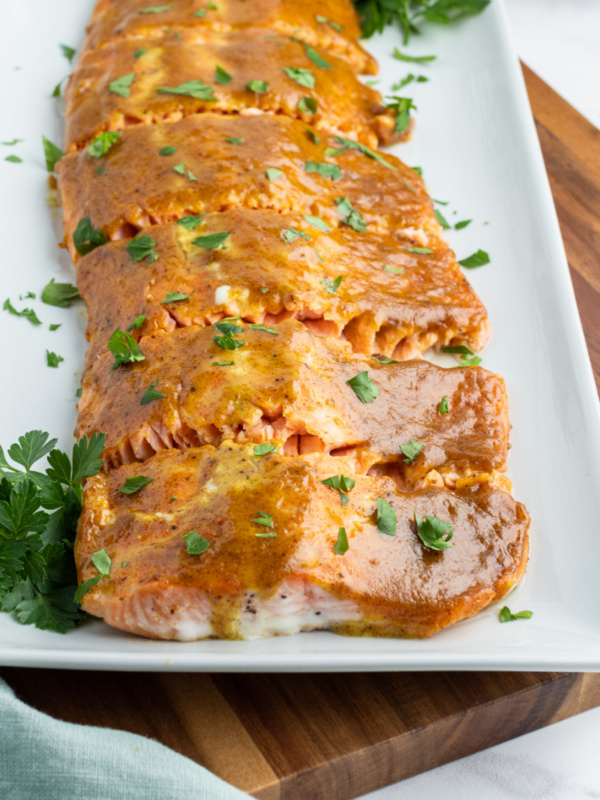 white tray with salmon with mustard and brown sugar glaze