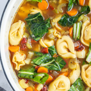 overhead shot of half a pot of sundried tomato tortellini soup